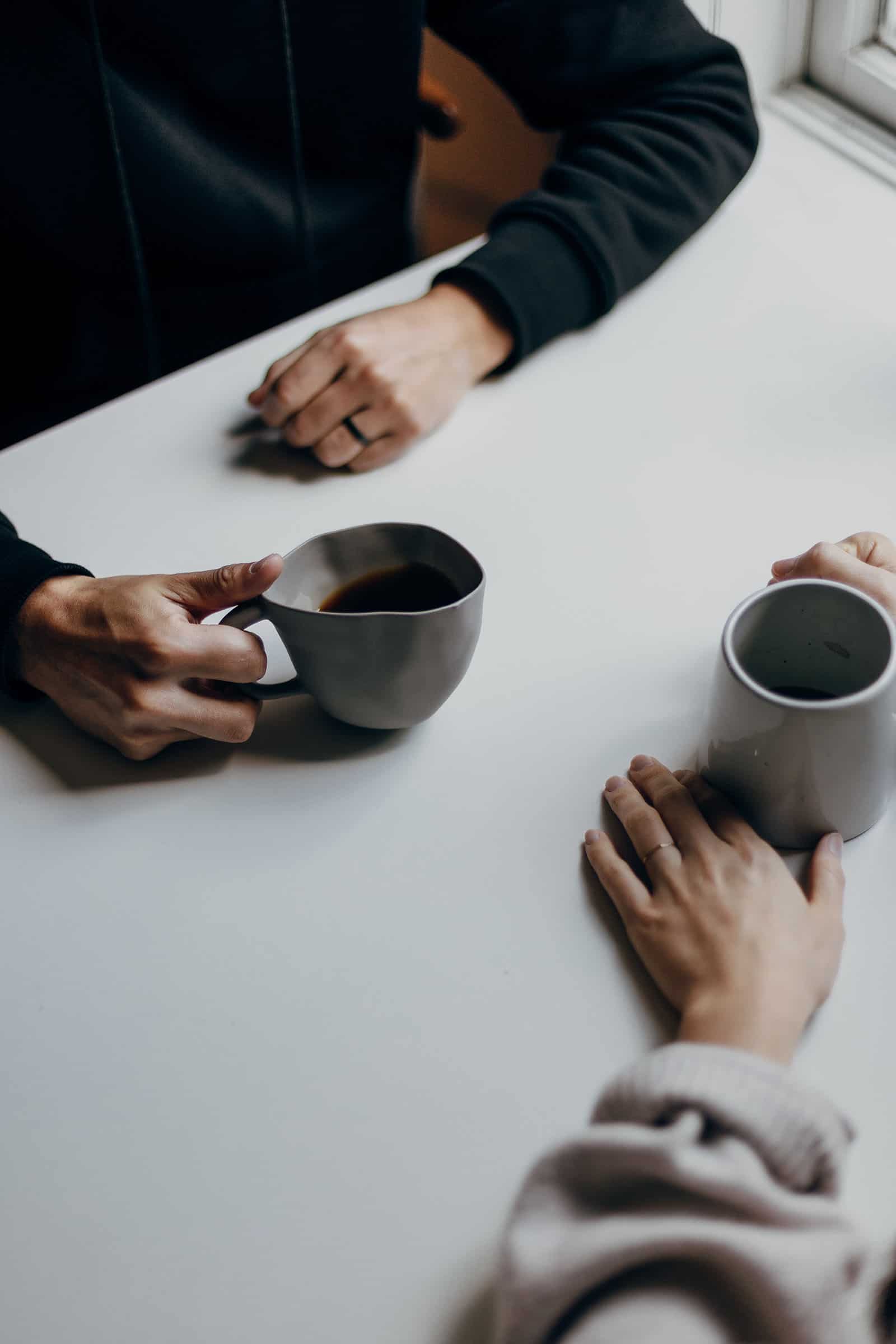 Drinking coffee in a meeting